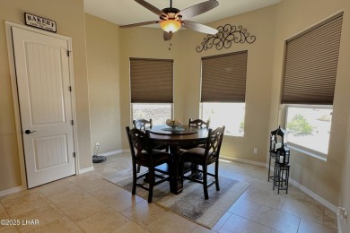 A Stunning RV Garage Pool Home in Lake Havasu City. Nestled on a on London Bridge Golf Course in Arizona - for sale on GolfHomes.com, golf home, golf lot