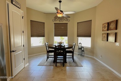 A Stunning RV Garage Pool Home in Lake Havasu City. Nestled on a on London Bridge Golf Course in Arizona - for sale on GolfHomes.com, golf home, golf lot