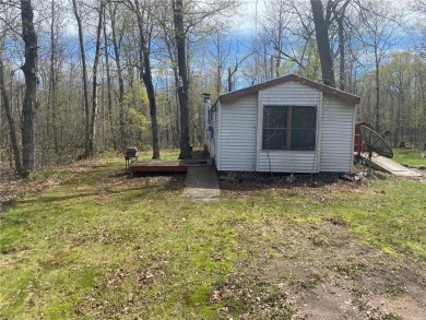 2 lots, nice location! 2 bedroom, 1 bath mobile home selling *AS on Hardwoods Golf Club At Mille Lacs in Minnesota - for sale on GolfHomes.com, golf home, golf lot