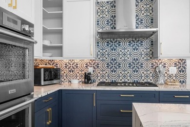 Embrace this beautiful crisp clean home with a harmonious on Monarch Country Club in Florida - for sale on GolfHomes.com, golf home, golf lot