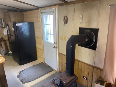 2 lots, nice location! 2 bedroom, 1 bath mobile home selling *AS on Hardwoods Golf Club At Mille Lacs in Minnesota - for sale on GolfHomes.com, golf home, golf lot