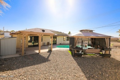 This 3-bedroom, 2-bath pool home is conveniently located in on London Bridge Golf Course in Arizona - for sale on GolfHomes.com, golf home, golf lot