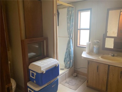 2 lots, nice location! 2 bedroom, 1 bath mobile home selling *AS on Hardwoods Golf Club At Mille Lacs in Minnesota - for sale on GolfHomes.com, golf home, golf lot