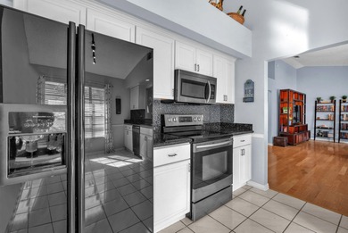 Beautifully maintained home located in a man-gated, golf course on Atlantic National Golf and Country Club in Florida - for sale on GolfHomes.com, golf home, golf lot