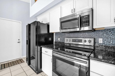 Beautifully maintained home located in a man-gated, golf course on Atlantic National Golf and Country Club in Florida - for sale on GolfHomes.com, golf home, golf lot