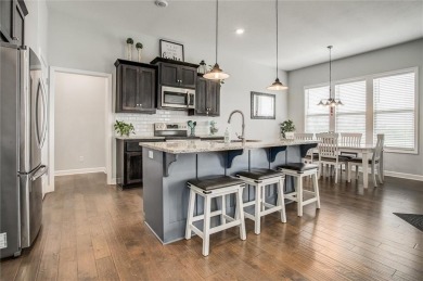 Tucked inside a premier resort-style neighborhood, this stunning on Golf Club of Creekmoor in Missouri - for sale on GolfHomes.com, golf home, golf lot