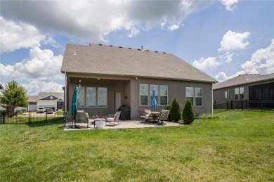 Tucked inside a premier resort-style neighborhood, this stunning on Golf Club of Creekmoor in Missouri - for sale on GolfHomes.com, golf home, golf lot
