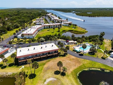 Lease purchase available. SPECTACULAR RIVERFRONT CONDO VILLA on Ocean Palm Golf Course in Florida - for sale on GolfHomes.com, golf home, golf lot