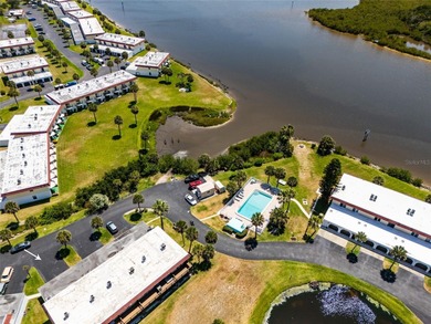 Lease purchase available. SPECTACULAR RIVERFRONT CONDO VILLA on Ocean Palm Golf Course in Florida - for sale on GolfHomes.com, golf home, golf lot