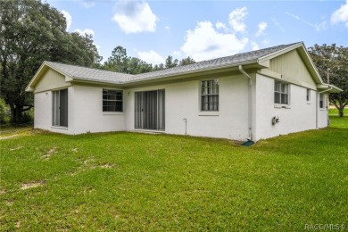 Spacious 4 BEDROOM home with 2 car garage on an OVERSIZED on Citrus Springs Country Club in Florida - for sale on GolfHomes.com, golf home, golf lot