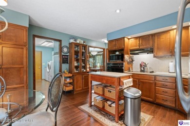 Experience tranquility and comfort in Brandenburg's premier on Doe Valley Country Club in Kentucky - for sale on GolfHomes.com, golf home, golf lot