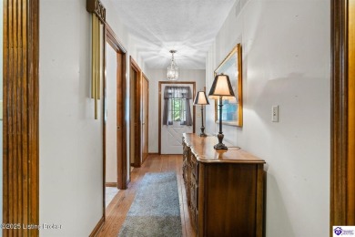 Experience tranquility and comfort in Brandenburg's premier on Doe Valley Country Club in Kentucky - for sale on GolfHomes.com, golf home, golf lot