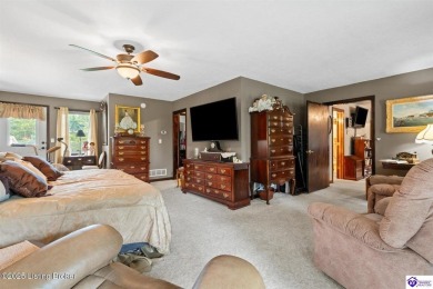 Experience tranquility and comfort in Brandenburg's premier on Doe Valley Country Club in Kentucky - for sale on GolfHomes.com, golf home, golf lot