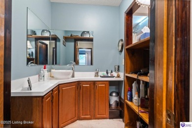 Experience tranquility and comfort in Brandenburg's premier on Doe Valley Country Club in Kentucky - for sale on GolfHomes.com, golf home, golf lot