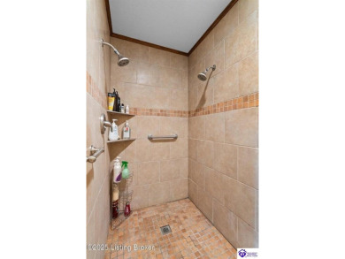 Experience tranquility and comfort in Brandenburg's premier on Doe Valley Country Club in Kentucky - for sale on GolfHomes.com, golf home, golf lot