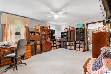Experience tranquility and comfort in Brandenburg's premier on Doe Valley Country Club in Kentucky - for sale on GolfHomes.com, golf home, golf lot