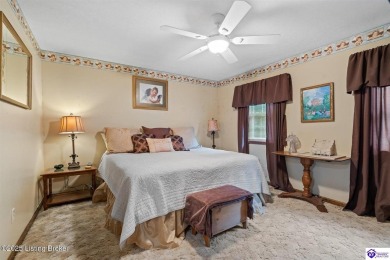 Experience tranquility and comfort in Brandenburg's premier on Doe Valley Country Club in Kentucky - for sale on GolfHomes.com, golf home, golf lot