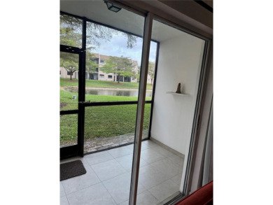 Enjoy the peace and quiet lake view from this bright ground on Sunrise Lakes Phase IV Golf Course in Florida - for sale on GolfHomes.com, golf home, golf lot