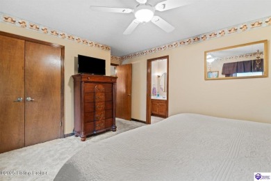 Experience tranquility and comfort in Brandenburg's premier on Doe Valley Country Club in Kentucky - for sale on GolfHomes.com, golf home, golf lot