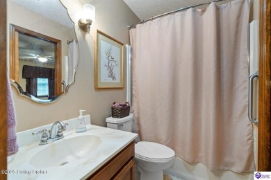 Experience tranquility and comfort in Brandenburg's premier on Doe Valley Country Club in Kentucky - for sale on GolfHomes.com, golf home, golf lot