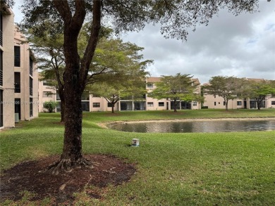 Enjoy the peace and quiet lake view from this bright ground on Sunrise Lakes Phase IV Golf Course in Florida - for sale on GolfHomes.com, golf home, golf lot