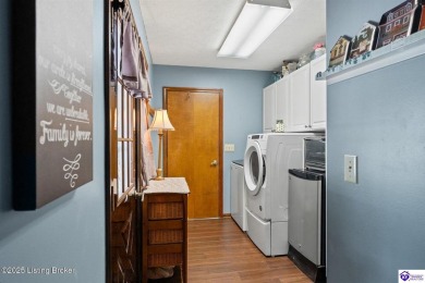 Experience tranquility and comfort in Brandenburg's premier on Doe Valley Country Club in Kentucky - for sale on GolfHomes.com, golf home, golf lot