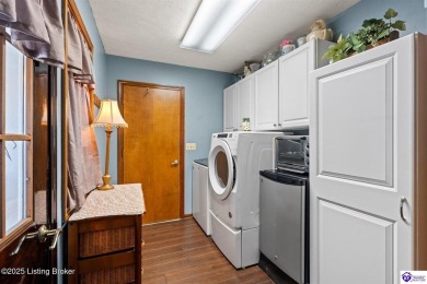 Experience tranquility and comfort in Brandenburg's premier on Doe Valley Country Club in Kentucky - for sale on GolfHomes.com, golf home, golf lot