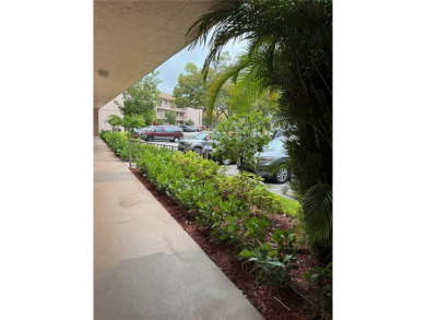 Enjoy the peace and quiet lake view from this bright ground on Sunrise Lakes Phase IV Golf Course in Florida - for sale on GolfHomes.com, golf home, golf lot