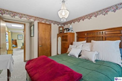 Experience tranquility and comfort in Brandenburg's premier on Doe Valley Country Club in Kentucky - for sale on GolfHomes.com, golf home, golf lot