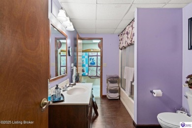 Experience tranquility and comfort in Brandenburg's premier on Doe Valley Country Club in Kentucky - for sale on GolfHomes.com, golf home, golf lot