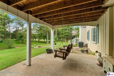 Experience tranquility and comfort in Brandenburg's premier on Doe Valley Country Club in Kentucky - for sale on GolfHomes.com, golf home, golf lot
