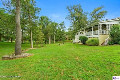 Experience tranquility and comfort in Brandenburg's premier on Doe Valley Country Club in Kentucky - for sale on GolfHomes.com, golf home, golf lot