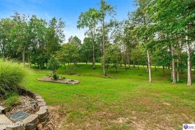 Experience tranquility and comfort in Brandenburg's premier on Doe Valley Country Club in Kentucky - for sale on GolfHomes.com, golf home, golf lot