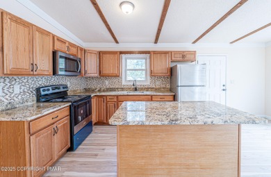 CHARMING UPGRADED POCONOS CHALET Completely Updated 3BR 2.5BA on Pocono Farms Country Club in Pennsylvania - for sale on GolfHomes.com, golf home, golf lot