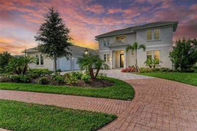 Stunning lake and golf course views are the backdrop for this on The Founders Golf Club in Florida - for sale on GolfHomes.com, golf home, golf lot