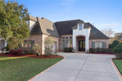 Enjoy serene water and golf course views from this exceptional on Oak Harbor Golf Club in Louisiana - for sale on GolfHomes.com, golf home, golf lot