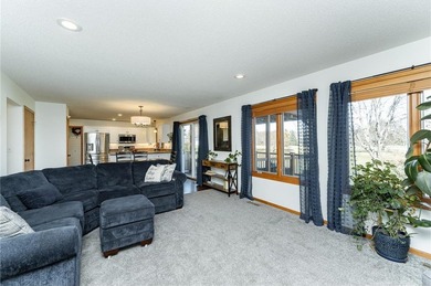 This 3-bed, 4-bath home on a full acre corner lot will not on Zumbro Valley Golf Club in Minnesota - for sale on GolfHomes.com, golf home, golf lot