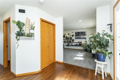 This 3-bed, 4-bath home on a full acre corner lot will not on Zumbro Valley Golf Club in Minnesota - for sale on GolfHomes.com, golf home, golf lot