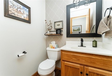 This 3-bed, 4-bath home on a full acre corner lot will not on Zumbro Valley Golf Club in Minnesota - for sale on GolfHomes.com, golf home, golf lot