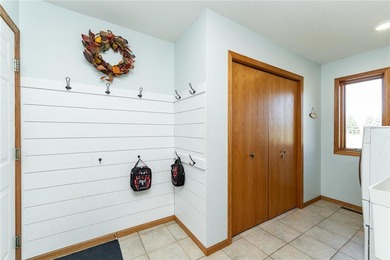 This 3-bed, 4-bath home on a full acre corner lot will not on Zumbro Valley Golf Club in Minnesota - for sale on GolfHomes.com, golf home, golf lot