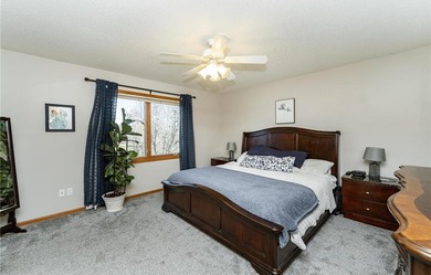 This 3-bed, 4-bath home on a full acre corner lot will not on Zumbro Valley Golf Club in Minnesota - for sale on GolfHomes.com, golf home, golf lot