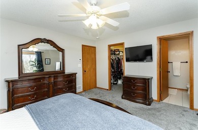 This 3-bed, 4-bath home on a full acre corner lot will not on Zumbro Valley Golf Club in Minnesota - for sale on GolfHomes.com, golf home, golf lot