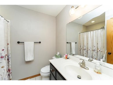 This 3-bed, 4-bath home on a full acre corner lot will not on Zumbro Valley Golf Club in Minnesota - for sale on GolfHomes.com, golf home, golf lot