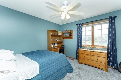 This 3-bed, 4-bath home on a full acre corner lot will not on Zumbro Valley Golf Club in Minnesota - for sale on GolfHomes.com, golf home, golf lot