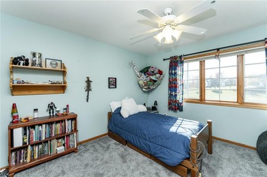 This 3-bed, 4-bath home on a full acre corner lot will not on Zumbro Valley Golf Club in Minnesota - for sale on GolfHomes.com, golf home, golf lot