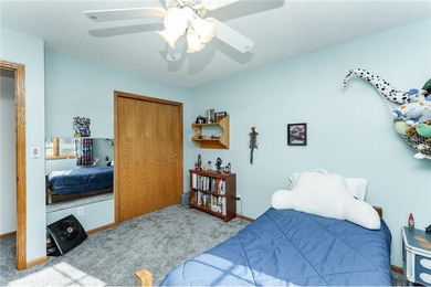 This 3-bed, 4-bath home on a full acre corner lot will not on Zumbro Valley Golf Club in Minnesota - for sale on GolfHomes.com, golf home, golf lot