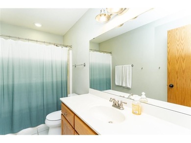 This 3-bed, 4-bath home on a full acre corner lot will not on Zumbro Valley Golf Club in Minnesota - for sale on GolfHomes.com, golf home, golf lot