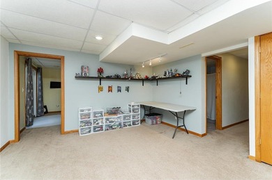 This 3-bed, 4-bath home on a full acre corner lot will not on Zumbro Valley Golf Club in Minnesota - for sale on GolfHomes.com, golf home, golf lot