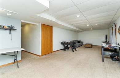 This 3-bed, 4-bath home on a full acre corner lot will not on Zumbro Valley Golf Club in Minnesota - for sale on GolfHomes.com, golf home, golf lot