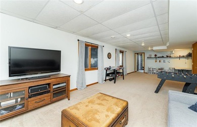 This 3-bed, 4-bath home on a full acre corner lot will not on Zumbro Valley Golf Club in Minnesota - for sale on GolfHomes.com, golf home, golf lot